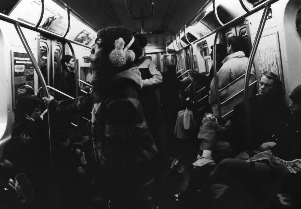 Passengers traveling together in a crowded New York subway car